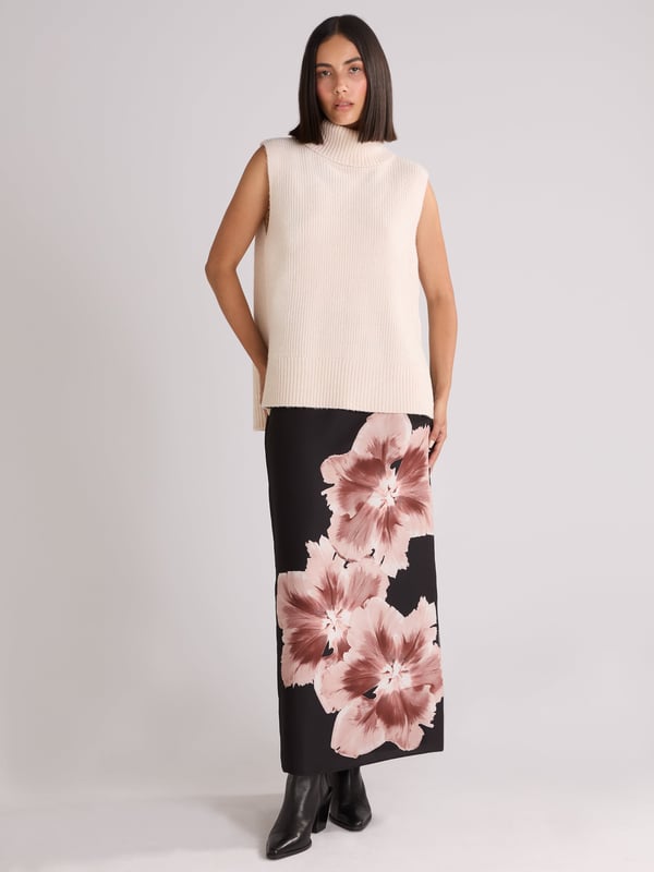 Co-founders' Notes

Our Mono Floral Placement Print Skirt is made from a recycled polyester mix satin back crepe, features a new mono floral design. This fully lined skirt includes a back zip, and a back skirt split for ease of wear. Its long midi length offers a stylish and comfortable fit.

Zip in back

Split in back skirt
Long midi length
True to size. Try your usual size



 Fabric &amp; Care



 Composition:   Main: 51% Recycled Polyester 49% Polyester Lining: 100% Viscose


 Garment Care:  Machine Washable


 Size &amp; Fit


True to size. Try your usual size

 Length: 90cm (size 10) 

Model is 170 cm/5'7" and is wearing a size 10