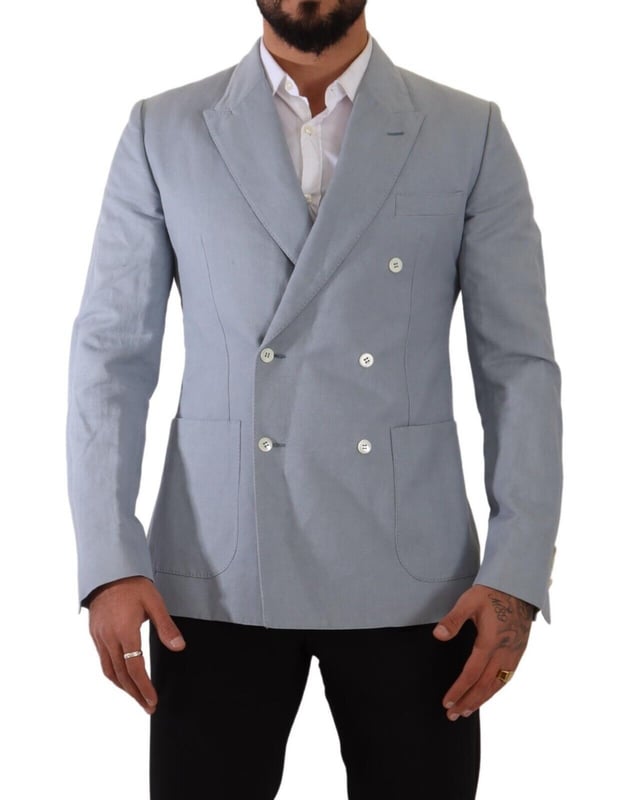 Brand: Dolce & Gabbana
  Style: Double breasted
  Fitting: Slim fit
  Colour: Light Blue
  Made in Italy
  Material: 60% Cotton 40% Flax
  Lining: 100% Viscose
  Logo details
  Very exclusive and high craftsmanship
Material: 60% Cotton 40% Flax