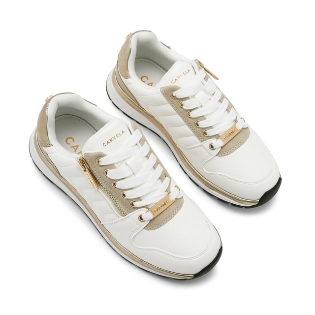 This Carvela Pace Zip trainer features a lace up front with gold zip detail at the eyestay and pin stud on the back. There is a gold band above the white sole.