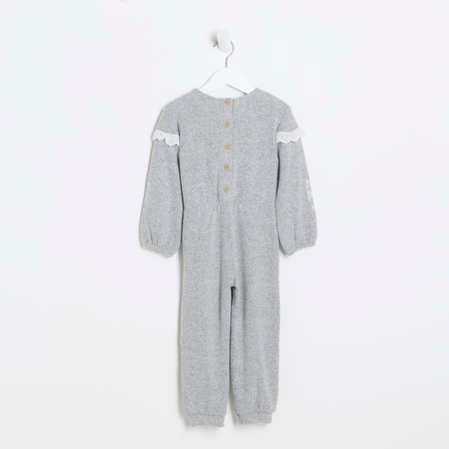 Broderie trim, Embroidered arm detail, Tie waist detail, Button back, Long sleeve, Cuffed hem