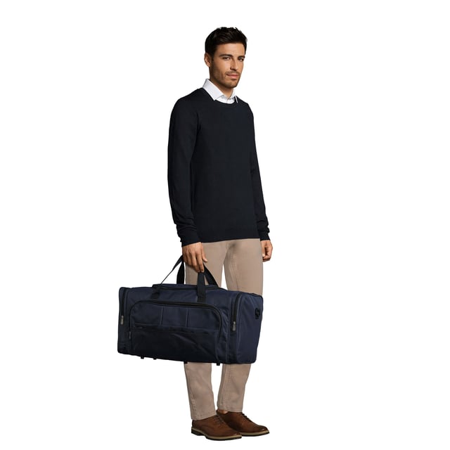 Large main compartment. Zipped pockets at each end. Zipped front pocket. Carry handles with pad. Adjustable/removable shoulder strap. Baseboard. Studded base. Material: 600D polyester. Dimensions: 30 x 56 x 26 cm.