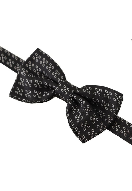 Stunning Dolce & Gabbana silk bow tie
  Black and white polka dot design
  Made from 100% silk
  Adjustable length neck strap
  Made in Italy
  Width: 6cm
Material: 100% Silk