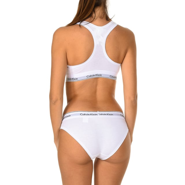 Calvin Klein Top and Briefs Set.
 White color
 Designed to guarantee comfort and softness.
 Elastic rubber, with the name of the brand embroidered consecutively.
 Inner lining.
 Seam seen to tone.

 Composition: 53% Cotton, 35% Modal, 12% Elastane

 Washing instructions:
 - Wash maximum at 40ºC.
 - Iron at medium temperature, max. 110 ° C.
 - Does not allow to use tumble dryer.
 - Do not use bleach.
 - It does not support dry cleaning.