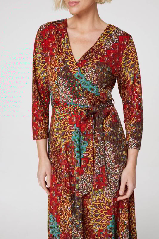 Every occasion collection needs an refreshing burst of colour like this peacock print wrap front dress. With a deep V-neck, a faux wrap front, a self-tie removable belt, 3/4 slim fit sleeves, an A-line skirt and a non-iron jersey stretch fabric.