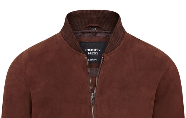 Introducing the Men's Varsity Suede Leather Bomber Jacket, a refined take on the classic MA-1 flight jacket. Crafted from 100% soft goat suede, this jacket offers exceptional durability and a supple drape. The exposed zip front features a wide, quilt stitch zip stand, complemented by a rib knit collar, cuffs, and hem for added warmth and a sleek silhouette. With four pockets�two at the waist and two inside, including a secure zipped pocket�this fully lined jacket combines style and functionality seamlessly.

� Made from 100% soft goat suede for durability and comfort
� Exposed zip front with quilt stitch zip stand
� Rib knit collar, cuffs, and hem for insulation
� Four pockets: two waist and two interior, one with a zip
� Fully lined interior for added warmth and comfort