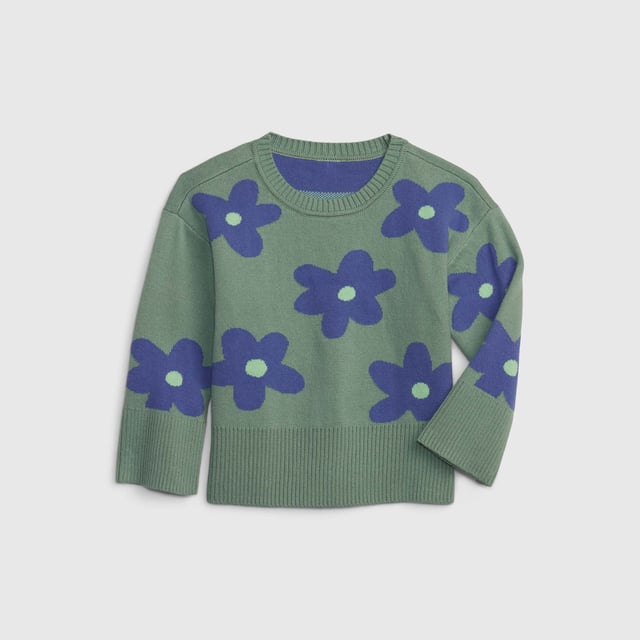 Girls' jumper made from a soft and comfortable fabric, ideal for keeping warm on cool days.

 It features a crew neck design and a slightly loose fit, allowing for greater freedom of movement.

 The sweater is decorated with a striking floral design, adding a fun and cheerful touch to the style.

 Ribbed cuffs and hem add texture, while side slits at the hem add modern detail and encourage movement.

 This sweater is perfect for combining with different casual outfits and adding a touch of color to little ones' wardrobe.
 Composition: 100% Cotton
 Care:
- Machine wash cold.
 - Use mild detergents.
 - Do not use a dryer.
 - Iron at low temperature.
 - Do not dry clean.