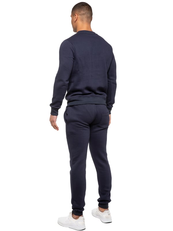 Conjunto de chándal Kruze Mens. Sudadera y Joggers con 2 bolsillos laterales, cordón, cintura acanalada y puños. Cómodo y elegante. Forro interior del forro polar cepillado. Mezcla de algodón para una calidad superior. Cuello redondo, mangas largas. Disponible en colores negro, gris y marino. 52% algodón, 48% poliéster. Lavable a máquina.