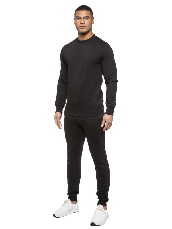 Kruze Mens Tracksuit set. Sweatshirt and Joggers set with 2 side Pockets, Drawstring, Ribbed Waist and Cuffs. Comfortable and Stylish. Inner lining of Brushed Back Fleece. Cotton Blend for Superior Quality. Crew Neck, Long Sleeves. Available in Black, Grey and Navy Colours. 52% Cotton, 48% Polyester. Machine Washable.
