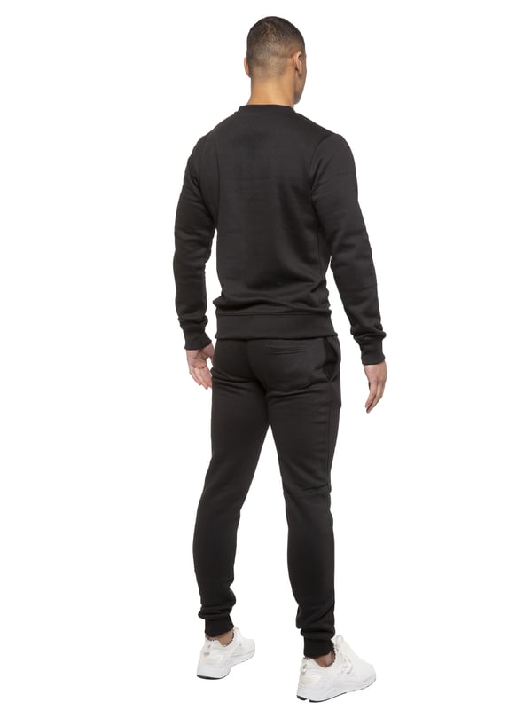 Kruze Mens Tracksuit set. Sweatshirt and Joggers set with 2 side Pockets, Drawstring, Ribbed Waist and Cuffs. Comfortable and Stylish. Inner lining of Brushed Back Fleece. Cotton Blend for Superior Quality. Crew Neck, Long Sleeves. Available in Black, Grey and Navy Colours. 52% Cotton, 48% Polyester. Machine Washable.