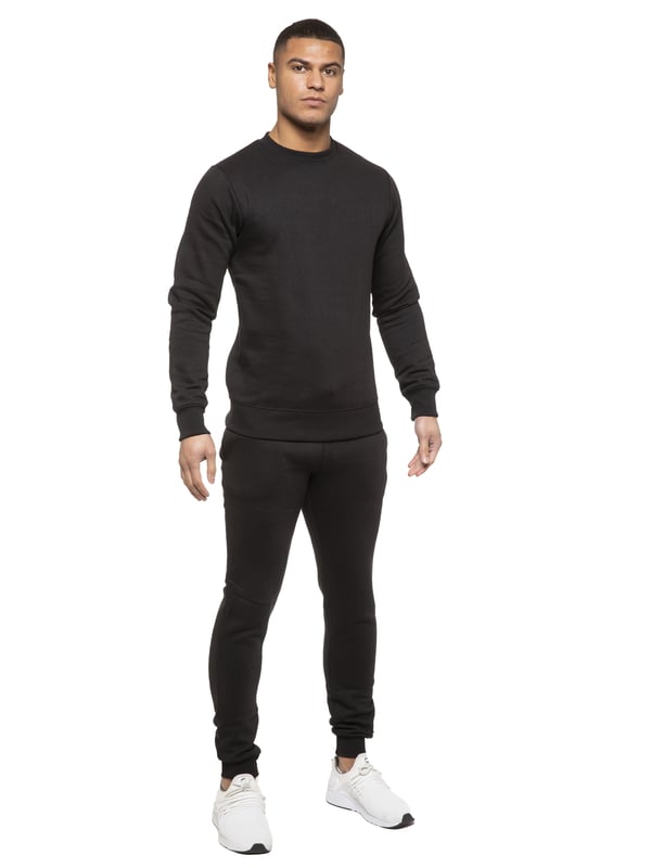 Kruze Mens Tracksuit set. Sweatshirt and Joggers set with 2 side Pockets, Drawstring, Ribbed Waist and Cuffs. Comfortable and Stylish. Inner lining of Brushed Back Fleece. Cotton Blend for Superior Quality. Crew Neck, Long Sleeves. Available in Black, Grey and Navy Colours. 52% Cotton, 48% Polyester. Machine Washable.