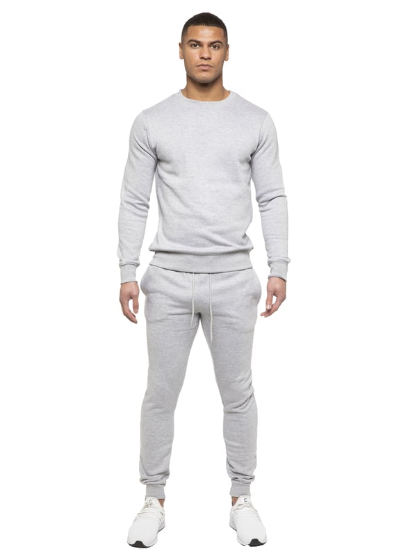 Kruze Mens Tracksuit set. Sweatshirt and Joggers set with 2 side Pockets, Drawstring, Ribbed Waist and Cuffs. Comfortable and Stylish. Inner lining of Brushed Back Fleece. Cotton Blend for Superior Quality. Crew Neck, Long Sleeves. Available in Black, Grey and Navy Colours. 52% Cotton, 48% Polyester. Machine Washable.