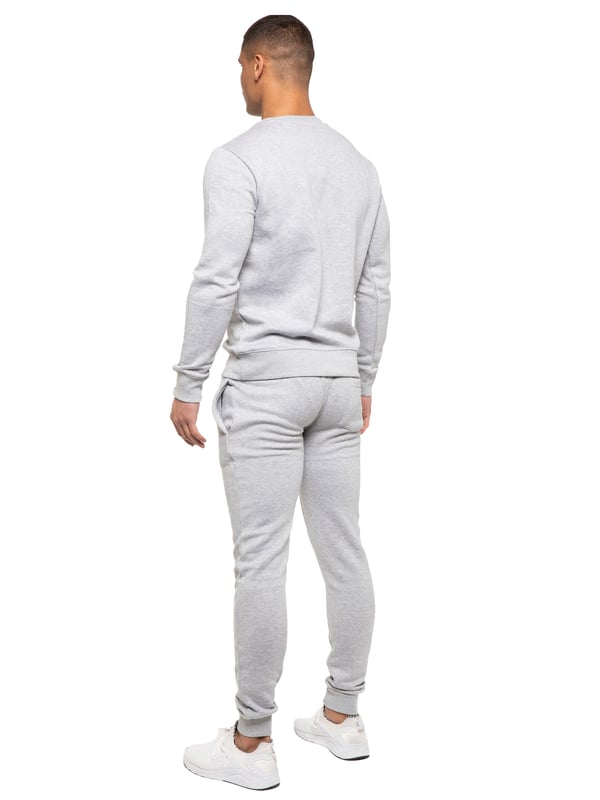 Kruze Mens Tracksuit set. Sweatshirt and Joggers set with 2 side Pockets, Drawstring, Ribbed Waist and Cuffs. Comfortable and Stylish. Inner lining of Brushed Back Fleece. Cotton Blend for Superior Quality. Crew Neck, Long Sleeves. Available in Black, Grey and Navy Colours. 52% Cotton, 48% Polyester. Machine Washable.