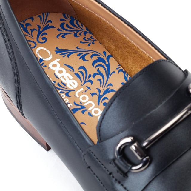 Base London Russo Leather Men's Black Loafers A refined addition to any man's footlocker, the Russo buckle loafer oozes sophistication. Genuine leather uppers, cushioned Ortholite insole and a polished horsebit buckle make Russo a no-brainer for the season.