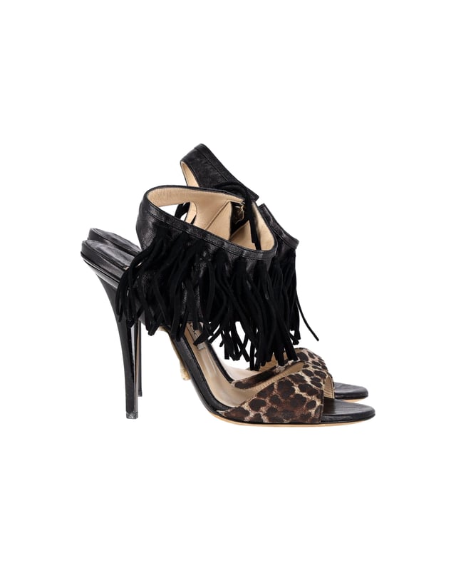 VINTAGE, RRP AS NEW
Add a touch of wild elegance to your footwear collection with the Jimmy Choo Leopard-Print Fringe Sandals. The leopard print is a bold choice that instantly elevates any outfit. The fringed details add a bohemian and eclectic touch, giving these sandals a unique and playful vibe. With an open-toe design and high heels, they are both stylish and flattering.

Jimmy Choo Leopard-Print Fringe Sandals in Black Leather
Condition: Very good with box
Sign of wear: Light wear on the soles and insoles, marks on the heel
Material: Leather
Color: Black
Size: IT36.5 / US6.5 / UK3.5
SKU: 357150 / TONPUGBSH357150W