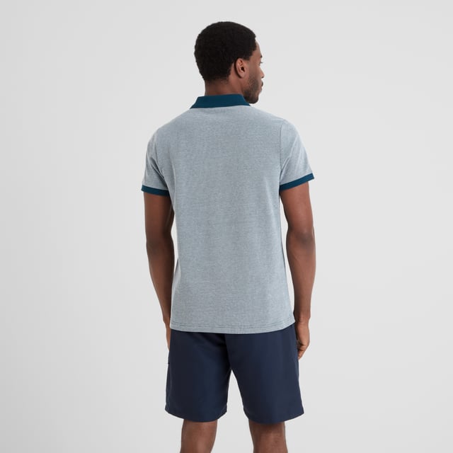 Whitley Mens Polo Shirt - Deep Sea Blue Made from comfy and sustainable cotton, TOG24's Whitley pique polo shirt effortlessly blends style with comfort. This polo shirt features branded buttons for an interesting touch of design flair and is made with ribbed cuffs and a ribbed collar for ease of wear.
