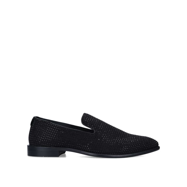 Crafted in a black suedette material, the Sting loafers are a formal style embellished with small black studs across the upper. The ankle features a very small red stitch sitting comfortably on a black block heel.