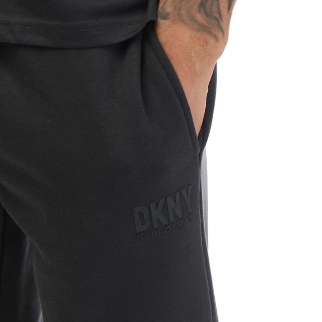 Mens DKNY Printed Logo Joggers in charcoal.- External drawcord.- Side pocket.- Back pocket.- Ribbed cuffs.- DKNY branding.- Flattering fit.- 72% Cotton  28% Polyester.- Ref: SDKD325CHA