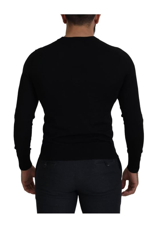 100% authentic Dolce & Gabbana cardigan sweater
  Crafted from Quality wool
  Classic black color
  Full button closure
  Logo details
  Made in Italy
  Material: 100% Virgin Wool
