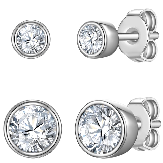 Mini or medium plugs - but definitely with a touch of glitter? This ear stud set from the Rafaela Donata label combines everything. Faceted zirconia crystals in two sizes in a simple bezel setting are among the classics in the jewelry box. Made from highly polished 925 sterling silver, the cool, shimmering silver stylishly frames the crystal sparkle - perfect for all silver jewelry fans. Rhodium plating reliably protects the radiant silver shine from tarnishing. Whether with jeans, in the office or for a festive look: the two pairs of ear studs have what it takes to be an everyday piece.
