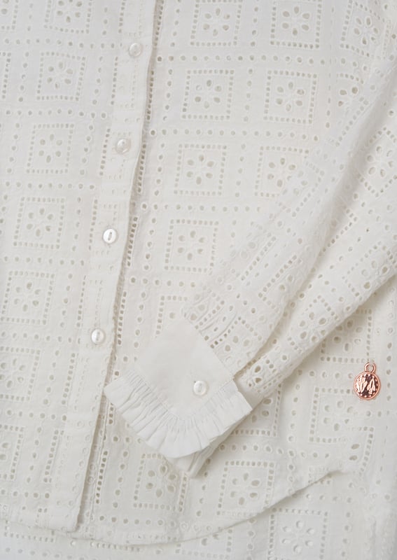 Our new Marcella shirt is defined by its all-over square broderie. With a high low hem. long sleeve and ruffle trim collar and cuffs. pair with our Kendal jean for outfit perfection.. About Me: 100% Cotton. Look After Me: Think Planet. Wash At 30C.