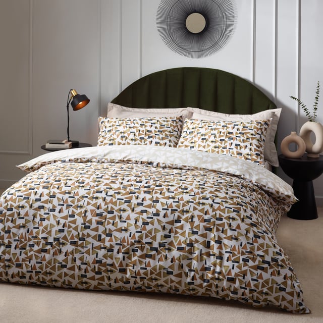 Inspired by modern, minimalist and abstract art, the City duvet cover set contains a fusion of small geometric shapes in warming tones, which combine to create this polished design. The reverse offers a muted, natural alternative for a more relaxing look. A sophisticated step into modern design for the contemporary home. This product is certified by OEKO-TEX® showing it has been sustainably made.