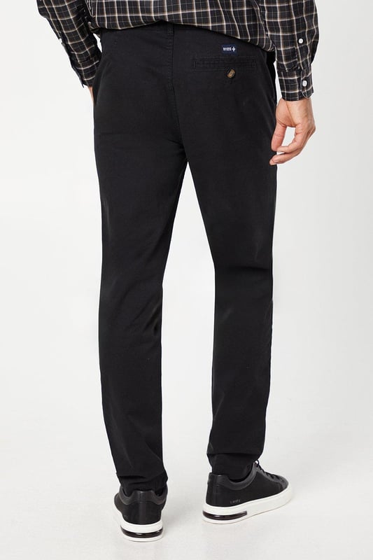 Slim fit design for a modern, tailored silhouette
        Versatile chino style suitable for various occasions
        Clean, streamlined appearance with minimal visible details
        Comfortable cotton-rich fabric for all-day wear
        Subtle branding for a refined look
    
    These Maine Premium Slim Fit Chino Trousers offer a perfect blend of style and comfort for the modern gentleman. The slim fit cut creates a sleek silhouette that flatters the body without compromising on ease of movement. Ideal for both casual outings and smart-casual events, these trousers can be effortlessly dressed up or down. For a relaxed weekend look, pair them with a crisp white t-shirt and trainers. Alternatively, create a more polished ensemble by teaming them with a button-down shirt and leather brogues for a family gathering or casual workplace setting. The versatility of these chinos makes them a wardrobe essential, easily transitioning from day to night. Their timeless design ensures they'll remain a staple in your collection for seasons to come, offering endless styling possibilities for the fashion-conscious man.