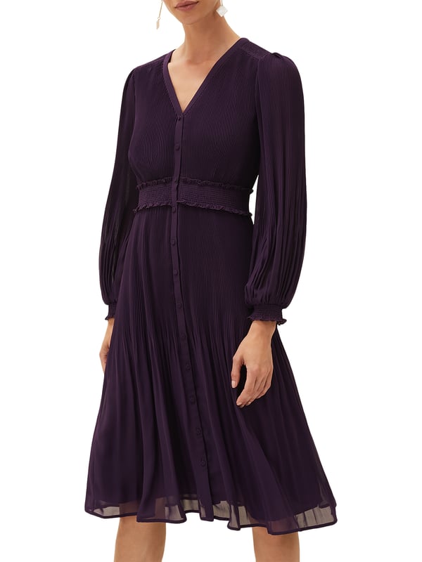 Embrace elegance with the Raelyn Ruched Dress in Aubergine, featuring a flattering ruched design and comfortable regular fit.