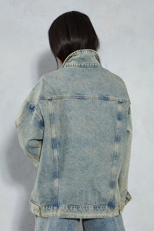 Oversized fit with dropped shoulders 
 Button front closure 
 Long sleeves with button cuffs 
 Chest pockets and welt hand pockets 

This denim oversized jacket from Misspap offers an effortlessly cool look. Crafted from cotton-rich denim in a stone washed finish, the jacket features an on-trend oversized silhouette with dropped shoulders and a relaxed fit through the body. Style with skinny jeans or leggings and a cropped top to balance the oversized shape. For cooler weather, layer over a chunky knit sweater. The versatile denim fabric and classic detailing make this an easy jacket to dress up or down. Throw it on over a slip dress and heeled sandals for drinks with friends or pair with trainers for a casual daytime look. With its slouchy borrowed-from-the-boys vibe, this jacket brings a laidback edge to any outfit. The stone wash gives it a lived-in, vintage appeal that reflects the Misspap aesthetic. A modern classic, it has the versatility to become a wardrobe staple for seasons to come.