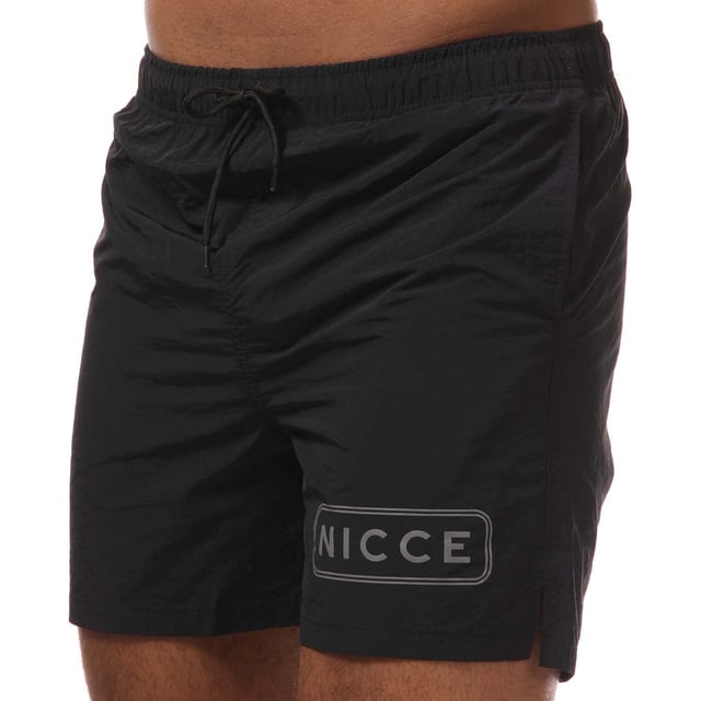 Mens NICCE Plinth Swim Shorts in black.- Elasticated drawstring waist.- Two open front pockets. - Single back pocket.- Mesh inner briefs.- Logo to leg.- Flat hem.- Regular fit.- Shell: 100% Nylon. Lining: 100% Polyester.- Ref: 1059W0050001