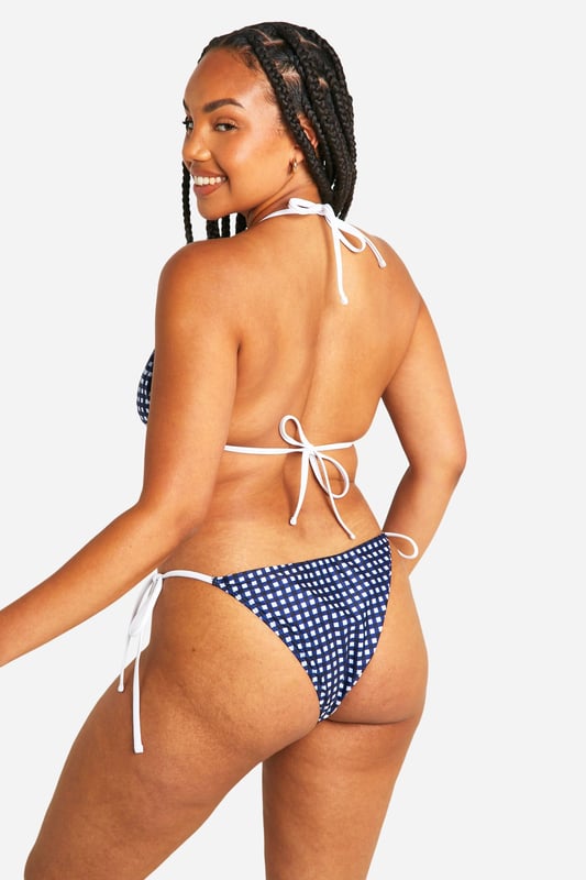 Sky high condfidence is inevitable in this plus size swimwear  from our latest collection. Curve enhancing, silhouette smoothing, and perfect for poolside lounging, this style is guaranteed to make you feel like the best version of yourself. Pair with a floaty kimono and some oversized sunnies and prepare to cause a storm. Need more inspo? Choose a plus size swimsuit for sunset loving nights at the beach or a plus size bikini to snatch that tan. Available in a range of prints, colours, and silhouettes, from high waisted to one pieces, grab yourself some dreamy curve swimwear that makes you feel confidently you.shop it all on boohoo.Style: Bikini BottomsDesign: GinghamFabric: Polyester
