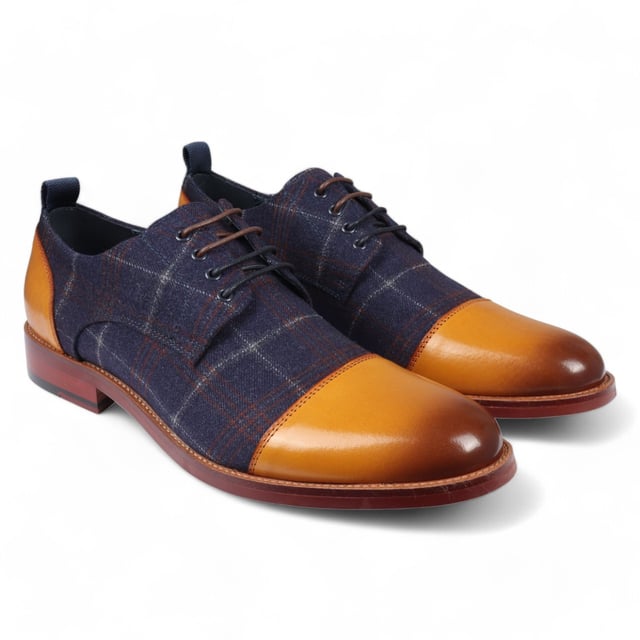 Dale estilo a los zapatos Oxford de cuero Ronnie de Justin Reess para hombre en una sofisticada combinación de colores azul marino y tostado. Estos zapatos Oxford presentan un diseño atemporal con un toque moderno, perfectos para eventos formales y entornos profesionales. Fabricados con cuero de alta calidad, ofrecen durabilidad, comodidad y un aspecto refinado que complementa cualquier conjunto. El cierre seguro con cordones garantiza un ajuste personalizable, brindando comodidad y estabilidad durante todo el día. Diseño Oxford clásico para un aspecto refinado y elegante Construcción de cuero de primera calidad para mayor durabilidad y comodidad Esquema de colores azul marino y tostado moderno para un estilo versátil Cierre seguro con cordones para un ajuste estable y personalizado