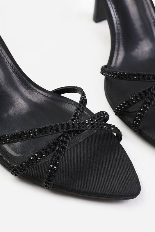 Step out in style and sophistication with our Audra Cross Over Strap with Gem Detailing Heels. These stunning heels are designed to elevate your outfit and add a touch of glamour to your every step.




Key Features:



Strappy Design: The multi-strap detail adds an elegant and polished touch to these shoes, making them the perfect option for those who want to make a fashion statement.

Comfortable Height: The mid-high heel provides stability and support, while the cushioned insole ensures all-day comfort. Walk confidently knowing that your feet will stay comfortable, no matter where the day takes you.

Open Toe: Open toe design adds a chic and fashionable element to these high heels, showcasing your pedicure and adding sophistication to any outfit.


Specifications:


Heel Height: 2’ (5.08cm) approx.
Strap Detail: Multi-strap design adds elegance and polish to these shoes
Closure: Buckle closure for a secure and adjustable fit


Elevate your style and make a statement with our Audra Cross Over Strap with Gem Detailing Heels. These shoes combine fashion and functionality, allowing you to showcase your individuality while enjoying all-day comfort. Step out with confidence and embrace your inner trendsetter.