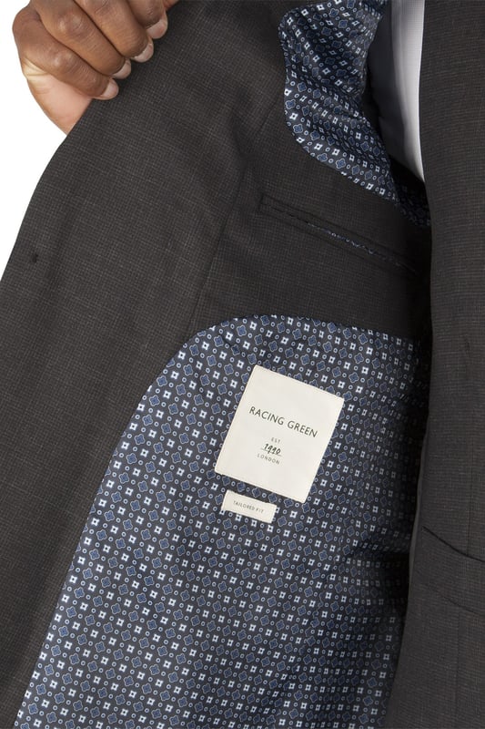 The Racing Green collection is presented with classic understated style and design. The use of classically British heritage that inspires the brand extends through to the cloth, design and typically confident use of colour. This luxury grey puppytooth suit is made from wool rich fabric. The 2 button jacket is on the Racing Green tailored block and features a notch lapel and side vents. The jacket has additional internal pockets including a pocket with a button through envelop flap for added security. Wear with the matching suit trousers and waistcoat to create the perfect look for any occasion.