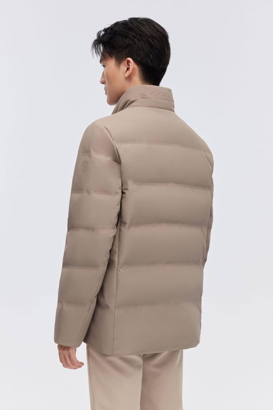 The Men's Classic Business Goose Down Jacket offers both warmth and elegance. With its luxurious 700+ fill goose down, heat-retaining lining, and showerproof seams, it ensures comfort in any weather. The sleek stand-up collar and refined design make it perfect for a professional, polished look.