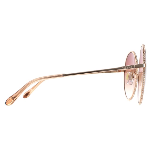 Chopard Round Womens Shiny Copper Gold Brown Gradient  SCHF11V  Sunglasses are a elegant round style crafted from lightweight metal. Silicone nose pads and plastic tips provide all day comfort. Slender temples feature the Chopard logo for authenticity.
