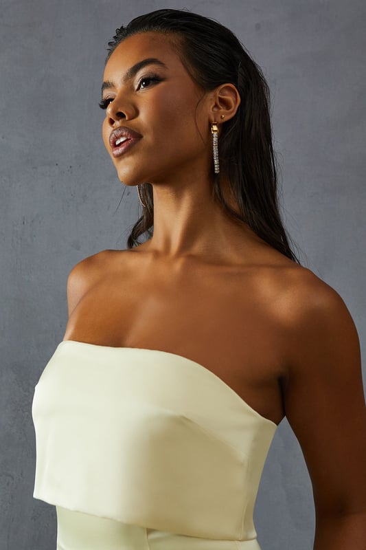 Elegant bandeau neckline with overlay detail
        Figure-hugging silhouette for a flattering fit
        Floor-length design perfect for formal occasions
        Luxurious satin fabric for a sophisticated look
        Sleek, strapless style to showcase your shoulders
    
    Make a striking entrance at your next formal event with this stunning bandeau overlay bridesmaid dress from MissPap. The sleek, strapless design features an elegant overlay detail that adds a touch of sophistication to the classic silhouette. The figure-hugging cut accentuates your curves, while the floor-length style ensures a dramatic sweep as you move. Perfect for weddings, galas, or any black-tie affair, this dress is versatile enough to be styled for various occasions. Pair it with strappy heels and statement earrings for a glamorous look, or opt for a delicate necklace and understated clutch for a more refined ensemble. The luxurious satin fabric catches the light beautifully, ensuring you'll shine throughout the evening. Whether you're a bridesmaid or a guest, this dress is sure to turn heads and make you feel like the belle of the ball.