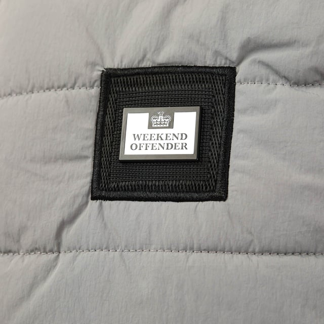 Mens Weekend Offender Jasper  Gilet in grey.- Stand-up collar.- Sleeveless.- Full centre front zip with zip puller.- Two zipped pockets.- DWR shower resistant coating.- Fully padded & thermal wadding.- Weekend Offender branding to chest.- Regular fit.- Shell: 100% Nylon with Polyurethane Backing. Lining: 100% Polyester.- Ref: WOSJK502N