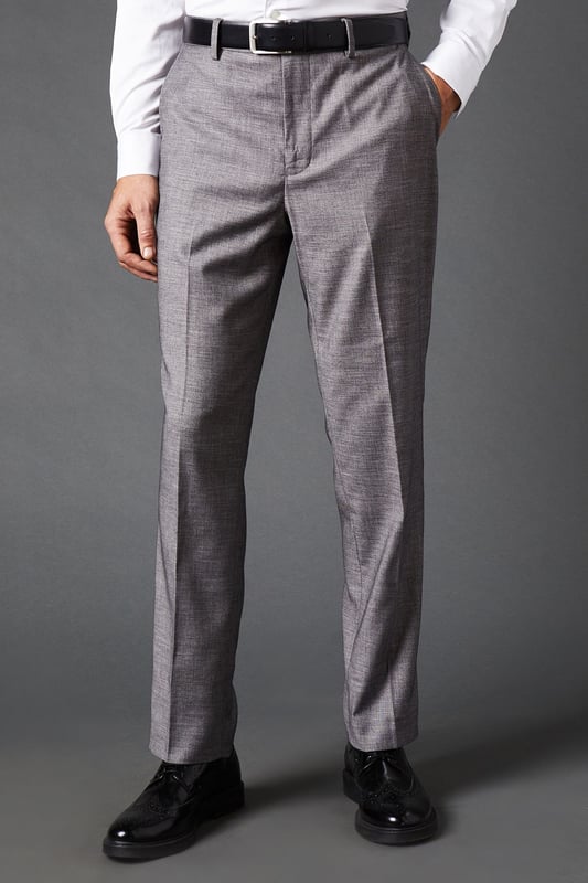 Tailored fit for a refined silhouette
        Sharkskin texture adds subtle sophistication
        Belt loops for versatile styling options
        Side pockets for practicality
        Pressed centre creases for a crisp look
    
    These mid grey sharkskin trousers offer a perfect balance of style and comfort, ideal for the modern gentleman who appreciates classic tailoring. The tailored fit sculpts your silhouette while allowing ease of movement, making them suitable for long days at the office or evening events. Pair them with a crisp white shirt and matching jacket for a complete suit look, or dress them down with a light jumper for smart-casual occasions. The versatile mid-grey hue allows for effortless coordination with various shirt colours and accessories. Whether you're heading to an important business meeting, a wedding, or a sophisticated dinner, these trousers will ensure you look polished and feel confident. Their timeless design makes them a wardrobe staple that will serve you well for years to come.