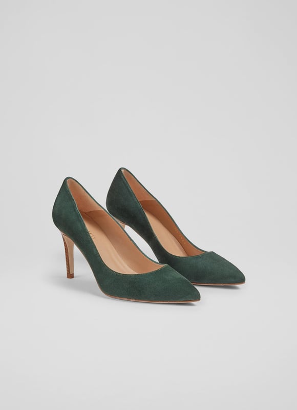 LK Bennett Floret Closed Courts,Dark Green An undeniable 'classic', our Floret courts are a much-loved LKB signature style, with a loyal fan base who appreciate their sleek and stylish everyday appeal. Beautifully-crafted in Spain from super-soft forest green suede, they have a pointed toe, a single sole and a wooden stacked 85mm stiletto heel. They're the perfect courts for dressy moments or for smartening up your workwear.
