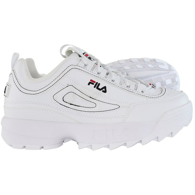 The Fila Disruptor Kids White Trainers are a classic and stylish choice for children's athletic and casual footwear. Here's a description of the key features:

 White Design:  These trainers come in a clean and timeless all-white color, making them a versatile and fashionable option that can be easily paired with a wide range of children's outfits.

 Chunky Sole:  One of the standout features of the Fila Disruptor series is the chunky and exaggerated sole design, which provides a distinctive and bold look.

 Leather Upper:  These trainers are typically constructed with a durable leather upper that offers both style and longevity, ideal for active kids.

 Padded Collar and Tongue:  The trainers usually come with a padded collar and tongue for added comfort and support around the ankles, which is important for kids.

 Lace-Up Closure:  They feature a traditional lace-up closure, allowing for a secure and customizable fit.

 Fila Branding:  You can expect to find the Fila logo and branding prominently displayed on these trainers, showcasing their authenticity and quality.

 Traction Outsole:  The trainers often have a durable and grippy rubber outsole, ensuring stability and grip on various surfaces, which is crucial for active children.

In summary, the Fila Disruptor Kids White Trainers are a fashionable and reliable choice for children who want a distinctive and stylish look in their athletic and casual footwear. The chunky sole design and classic all-white color make these trainers stand out, and the combination of leather and padded elements provides comfort and durability. Fila's iconic branding and quality are showcased in this model, making it an excellent option for parents looking for both style and functionality in their children's footwear.
