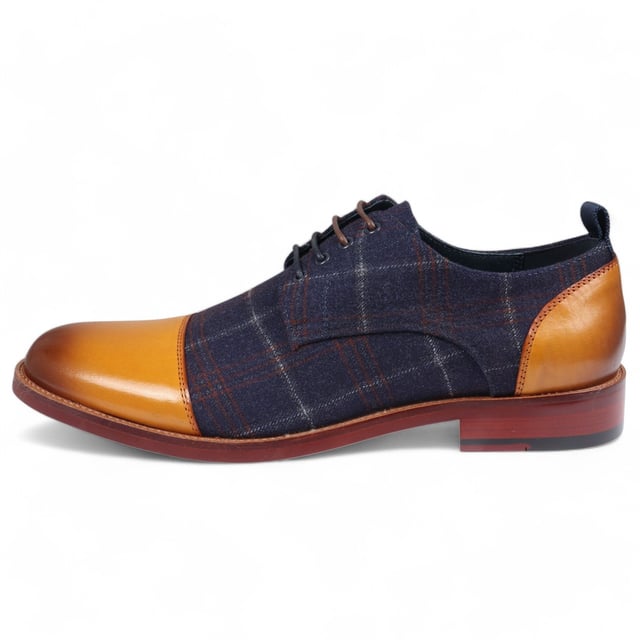 Dale estilo a los zapatos Oxford de cuero Ronnie de Justin Reess para hombre en una sofisticada combinación de colores azul marino y tostado. Estos zapatos Oxford presentan un diseño atemporal con un toque moderno, perfectos para eventos formales y entornos profesionales. Fabricados con cuero de alta calidad, ofrecen durabilidad, comodidad y un aspecto refinado que complementa cualquier conjunto. El cierre seguro con cordones garantiza un ajuste personalizable, brindando comodidad y estabilidad durante todo el día. Diseño Oxford clásico para un aspecto refinado y elegante Construcción de cuero de primera calidad para mayor durabilidad y comodidad Esquema de colores azul marino y tostado moderno para un estilo versátil Cierre seguro con cordones para un ajuste estable y personalizado