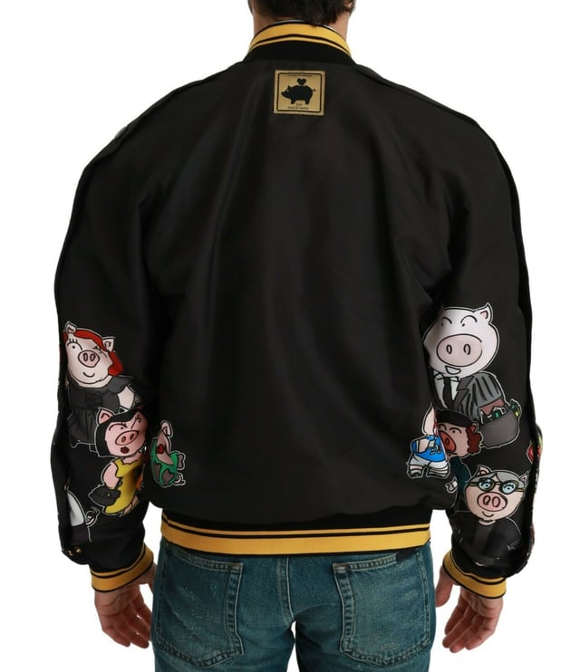 100% Authentic Dolce & Gabbana Bomber Jacket
  Black with multicolor pig motif
  2019 Year of the Pig Family inspired design
  Regular fit with zipper closure
  Two outside pockets and two inside pockets
  Dolce & Gabbana logo details
  Made in Italy with high craftsmanship
  Material: 100% Polyester Lining: 100% Polyester
Material: 100% Polyester