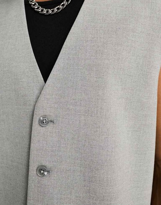Suits by ASOS DESIGN Serving business chic V-neck Button placket Boxy fitSold By: Asos