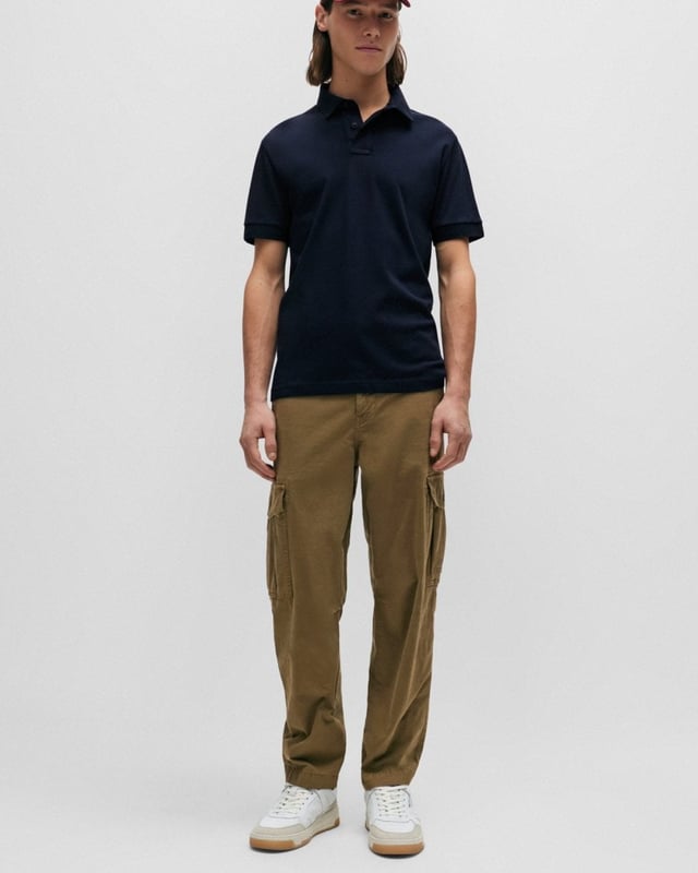 A slim-fitting polo shirt with short sleeves by BOSS Menswear, crafted in soft piqué with a tonal logo patch. By purchasing this product, you are contributing to protecting the environment and sustainable cotton farming in Africa. CmiA is committed to improving the living and working conditions of African cotton farmers and to preserving nature.
Slim fitFlat-knit collarNumber of buttons: 3Short sleevesFlat-knit cuffs
95% Cotton, 5% Elastane
50507803