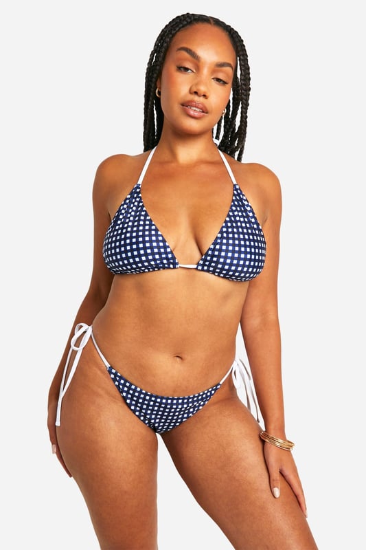 Sky high condfidence is inevitable in this plus size swimwear  from our latest collection. Curve enhancing, silhouette smoothing, and perfect for poolside lounging, this style is guaranteed to make you feel like the best version of yourself. Pair with a floaty kimono and some oversized sunnies and prepare to cause a storm. Need more inspo? Choose a plus size swimsuit for sunset loving nights at the beach or a plus size bikini to snatch that tan. Available in a range of prints, colours, and silhouettes, from high waisted to one pieces, grab yourself some dreamy curve swimwear that makes you feel confidently you.shop it all on boohoo.Style: Bikini BottomsDesign: GinghamFabric: Polyester