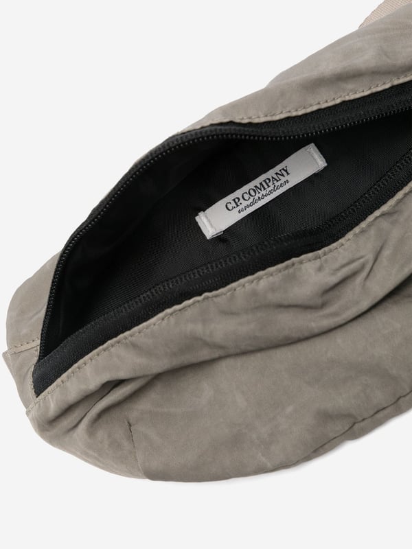 Introducing the Boys Logo Belt Bag in Green by CP Company‚ an essential accessory for AW2024, blending high-end craftsmanship with functional design. Key features include:‚ Signature CP Company Aesthetics: Showcases the iconic logo in a vibrant green hue, ensuring standout style.  ‚ Ergonomic Design: Perfectly sized for boys, with adjustable straps for a comfortable, custom fit.  ‚ Durable Material: Crafted from premium materials, built to withstand daily wear and tear.  ‚ Versatile Accessory: Elevates any outfit, from casual to chic. Ideal for everyday adventures or special occasions.Add this stylish and sturdy piece to your boy's wardrobe today!