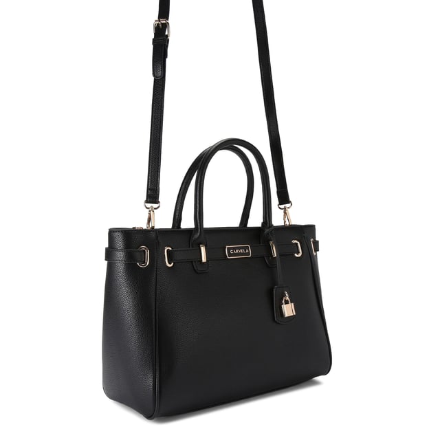 The Carvela Violet Belted Tote bag features a textured black upper that is accented with a branded belt around the straps. Dimensions: 25cm (H), 34cm (L), 15cm (D). Strap length: 126cm.