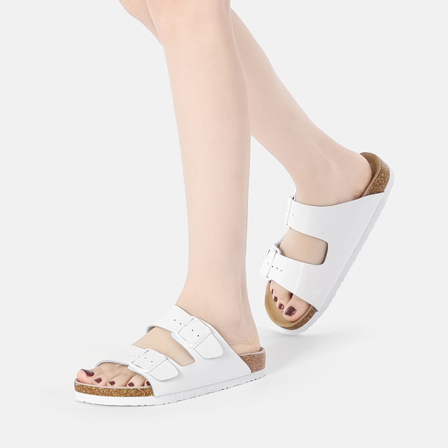 Toss your beach bag over your shoulder and slide into our Mallard Slides for all-day comfort. With their double straps, your feet will stay happy from sunrise to sunset. Plus, these shoes come packed with extra comfort and safety features, including adjustable buckle straps, a cushioned cork sole, and a waffle-like pattern for enhanced grip on wet surfaces.

Product No. EAU5001

Description: - Leather Upper - Cowhide Midsole - EVA Sole