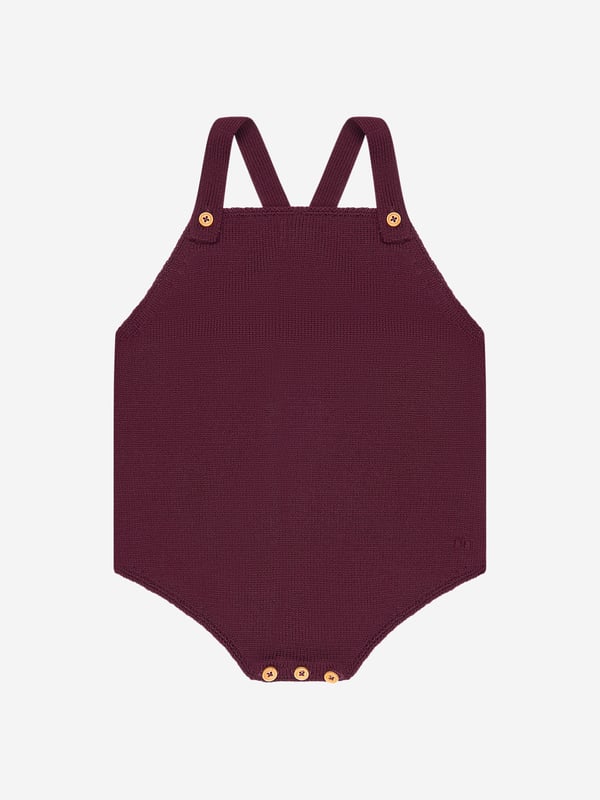 A charming rompersuit designed for your little one by luxury label Bonpoint. The rich purple suit is constructed from soft wool with a crossover back and delicate button fastenings on the straps. Layered up or worn alone, this is a timeless piece for your baby.