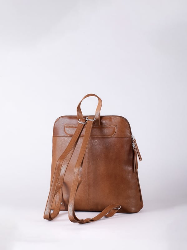 The Talkin handbag collection is a study in sleek sophistication, and this practical backpack is no exception. Crafted from soft premium leather, this classic style has plenty of space to ensure you can carry all your essentials with ease. The adjustable leather straps offer unparalleled comfort, and we've included a grab handle for convenient carrying.